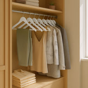 Close-up of the smooth contoured shoulder shape on the coat hanger