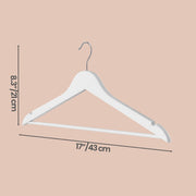 Birch wood coat hangers holding jackets in a wardrobe