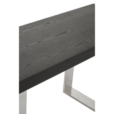 Close-up of the brushed silver stainless steel sledge base of the console table