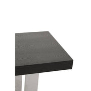 Close-up of the join between the elm wood plinth and the stainless steel frame