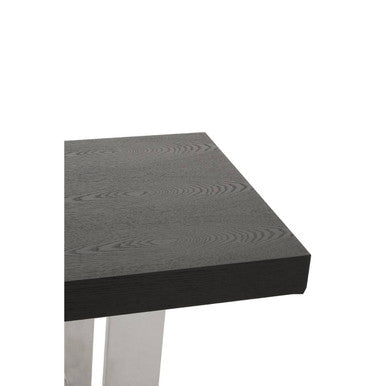 Close-up of the join between the elm wood plinth and the stainless steel frame