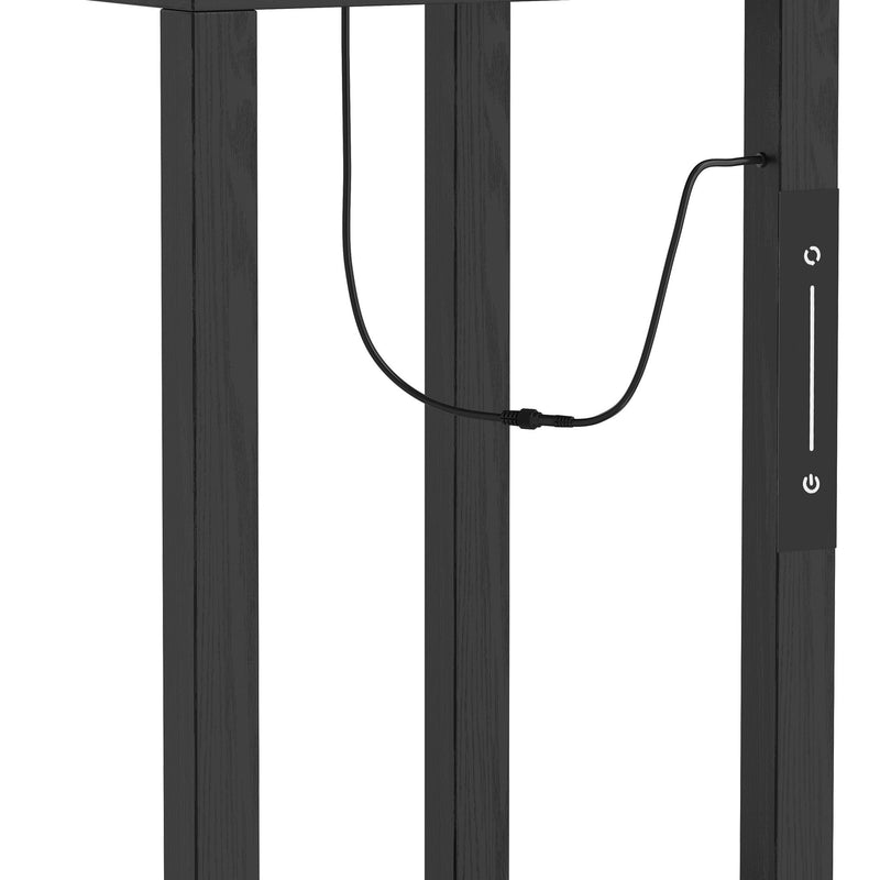 Close-up of the lamp's black frame legs with the power cable running down the side