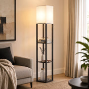 Floor lamp with shelves glowing beside an armchair in a cosy living room