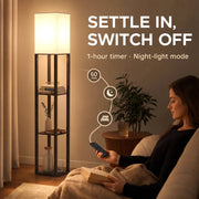 Woman relaxing with a phone beside the floor lamp, showing 1-hour timer and night light mode