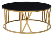 Angled studio view of the round coffee table showing the open brushed gold frame structure