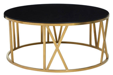 Angled studio view of the round coffee table showing the open brushed gold frame structure