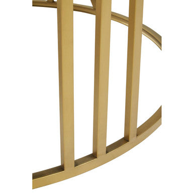 Close-up of the black tempered glass top edge where it meets the gold frame