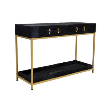Angled studio view of the hair-on-hide console table showing the slim gold metal legs