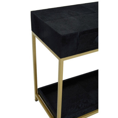 Close-up of the gold metal frame corner joint on the console table