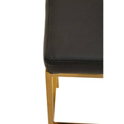 Close-up detail of seat edge and gold frame on bar stool