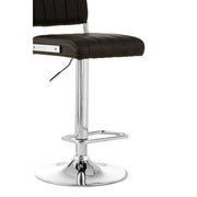Close-up of chrome column and square footrest on black bar stool