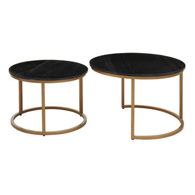 Set of two round black marble coffee tables with gold iron frames, separated, on a plain background