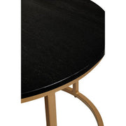 Close-up of the natural veining across the deep black marble tabletop