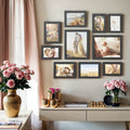 Set of 10 black picture frames in three sizes arranged together
