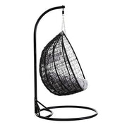 Front view of the black rattan double hanging chair on a plain background