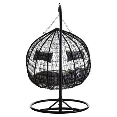 Angled view of the black rattan double hanging chair, plain background