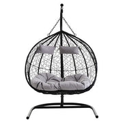 Black rattan double hanging chair, studio shot