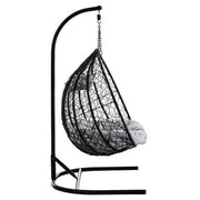 Front view of the black rattan double hanging chair on a plain background