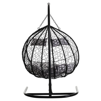 Angled view of the black rattan double hanging chair, plain background