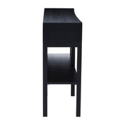 Angled view of the black console table showing the criss-cross rattan drawer fronts