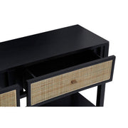 Close-up of the woven criss-cross rattan drawer front on the black console table
