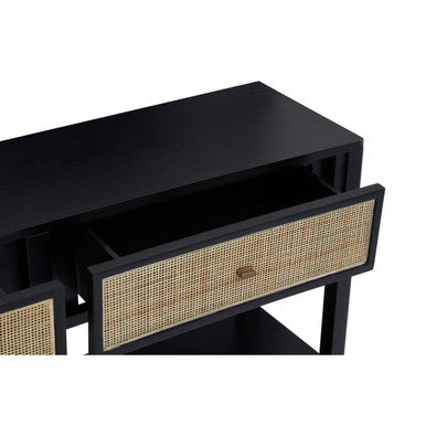 Close-up of the woven criss-cross rattan drawer front on the black console table