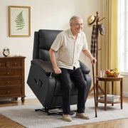 Man using a cane to stand up from the lifted black riser recliner chair