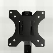 Close-up of the black monitor mounting plate on the single arm