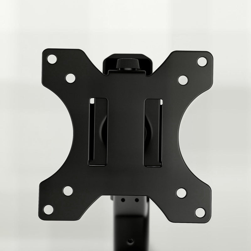 Close-up of the black monitor mounting plate on the single arm