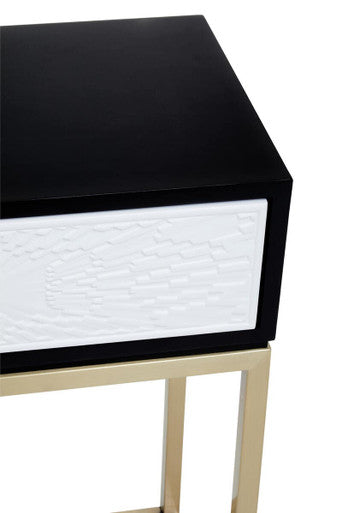 Close-up of the resin-formed decorative pattern and knob handle on the white drawer front