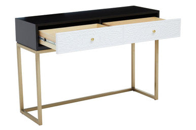 Angled view of the black and white console table showing the slim gold sledge base