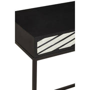 Close-up of the hand-applied white bone inlay chevron pattern on the black table top