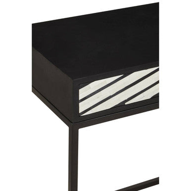 Close-up of the hand-applied white bone inlay chevron pattern on the black table top