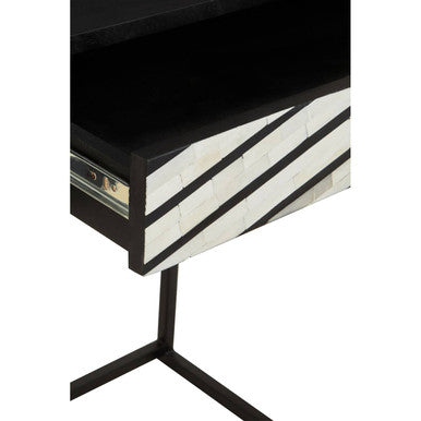 Close-up of the cast floral drawer knob on the bone inlay console table
