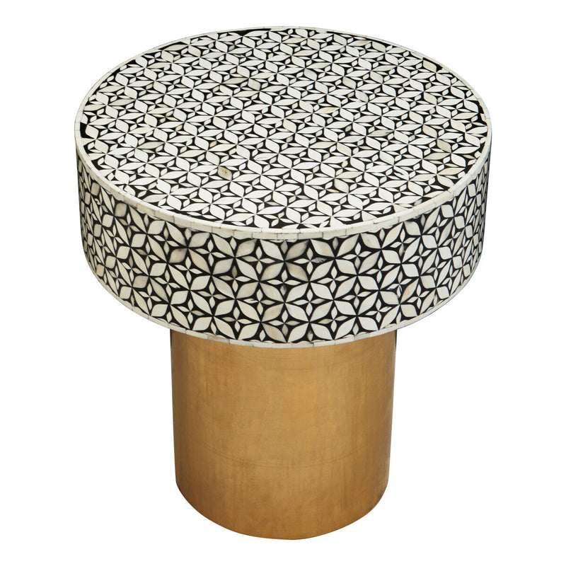 Overhead view of the symmetrical white bone inlay floral motif on the black round top