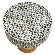 Angled studio view of the round bone inlay side table showing its 55cm height