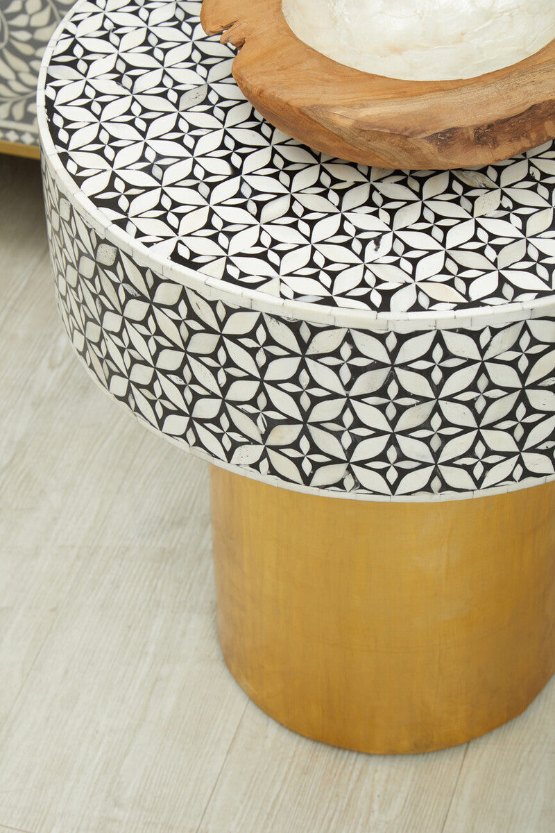 Pair of bone inlay side tables flanking a sofa for symmetry