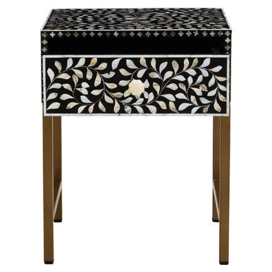 Front view of the black side table with white floral bone inlay drawer front