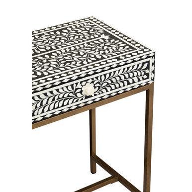 Close-up of the drawer knob and inlay border on the console table front