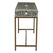 Side profile showing the gold-finish metal legs lifting the console off the floor