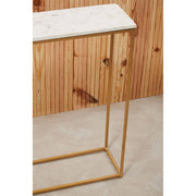 Living room view of the gold-framed marble console with the open base visible