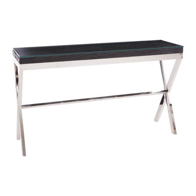 Front view of the black wood console table with clear glass top and silver crossed-leg frame