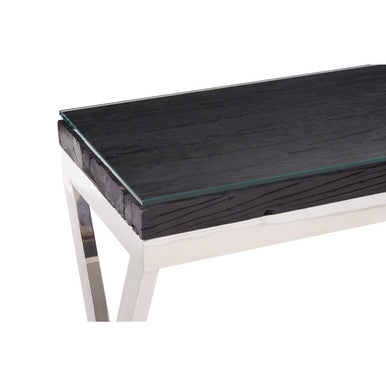 Close-up of the clear glass layer over the black pinewood console table top
