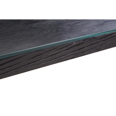 Detail shot of the console table corner showing the glass edge over the black top