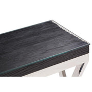 Close-up of the silver steel foot of the console table on a floor surface