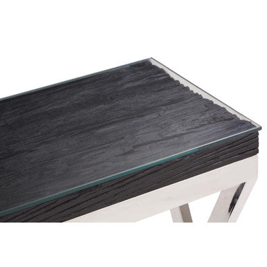 Close-up of the silver steel foot of the console table on a floor surface