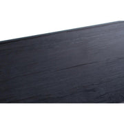 Macro detail of the black wood grain visible through the clear glass surface