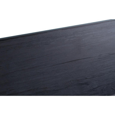 Macro detail of the black wood grain visible through the clear glass surface