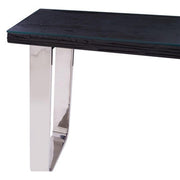 Close-up of the polished stainless steel U-shaped leg and its mirror finish