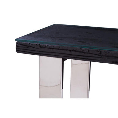 Detail of the join between the silver metal frame and the glass tabletop edge